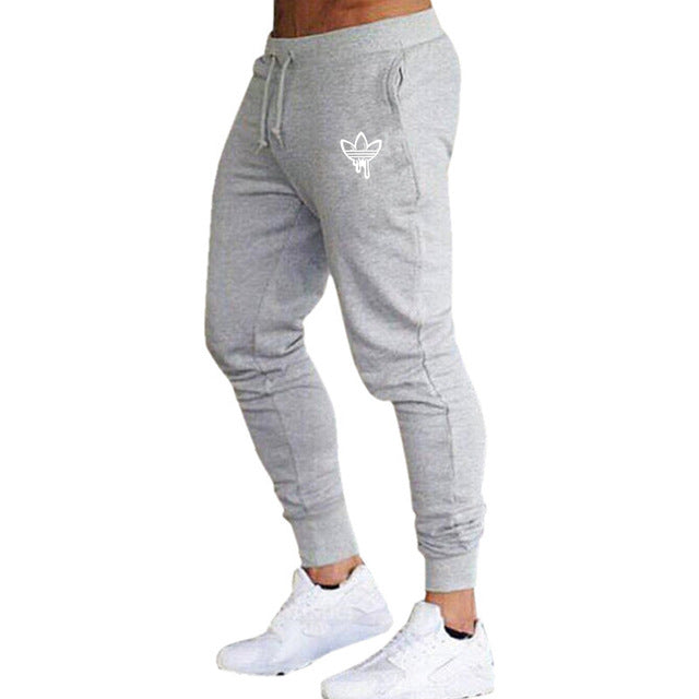 New Brand Print logo Gyms Men Joggers Casual Men Sweatpants Joggers Pantalon Homme Trousers Sporting Clothing Bodybuilding Pants
